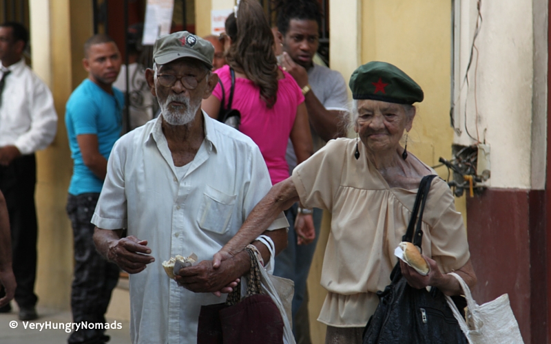 Older couple hand in hand on the streets of Havana, Cuba - People we meet travelling