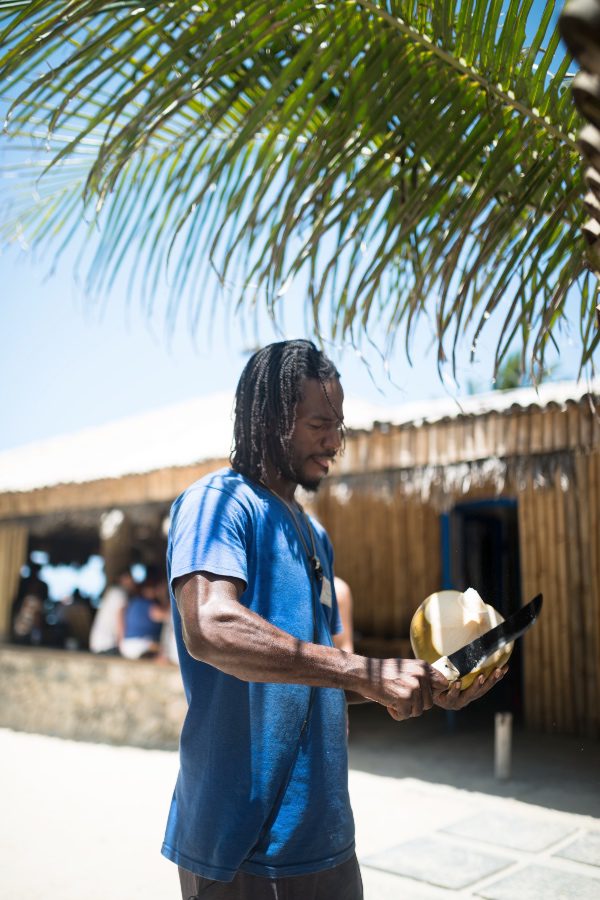 Jamaican man with coconut