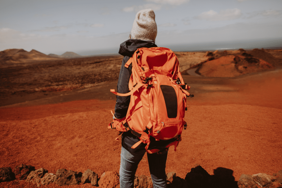 Packing List for Africa girl with red backpack africa