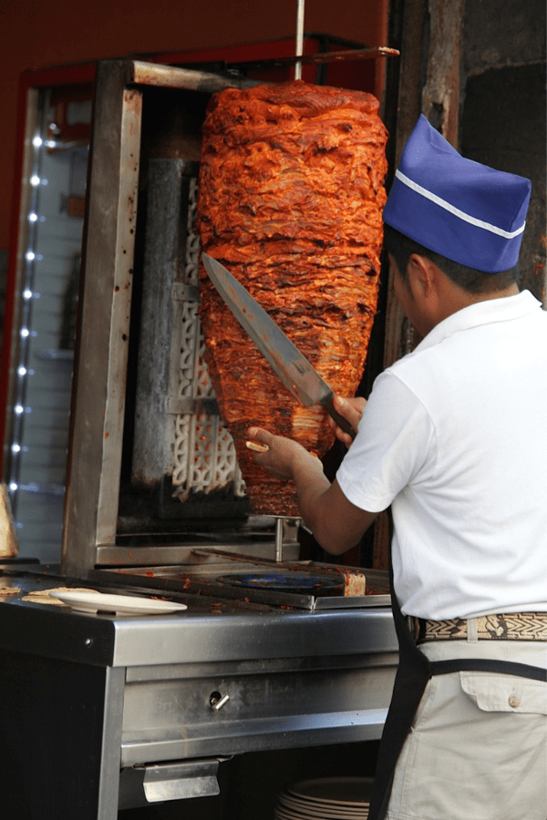 Mexican Foods - Tacos al pastor slicing meat