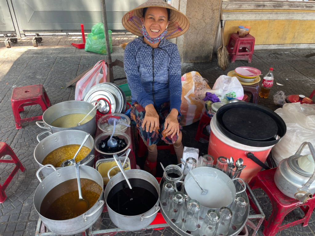 Smiling Street food vendor in Hoi An