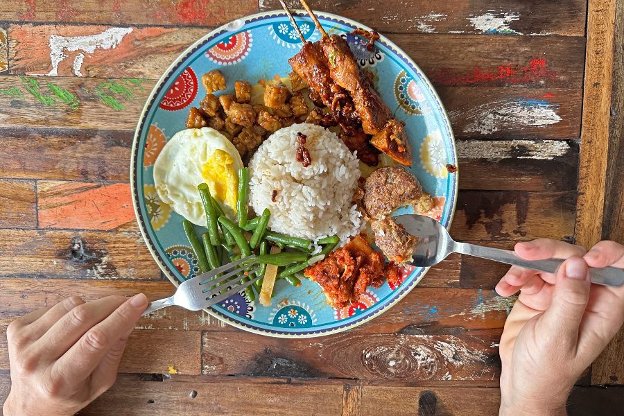 best warung canggu food with hands eating