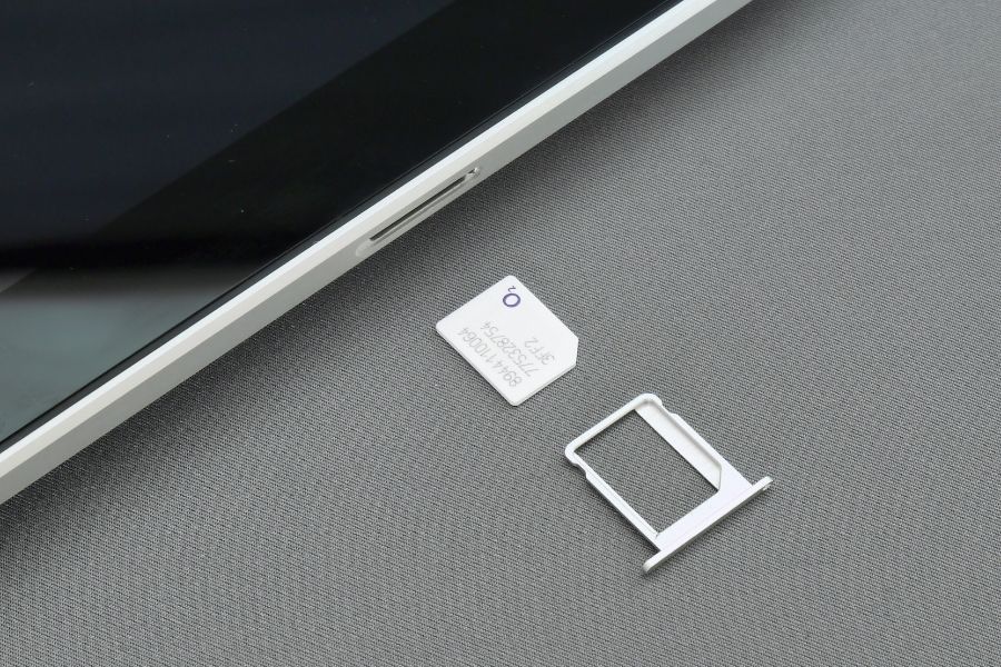 how to change SIM card in iPhone SIM tray