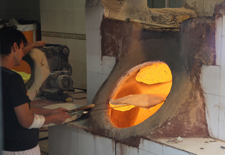 Baker churns out delicious bread from the tandoor