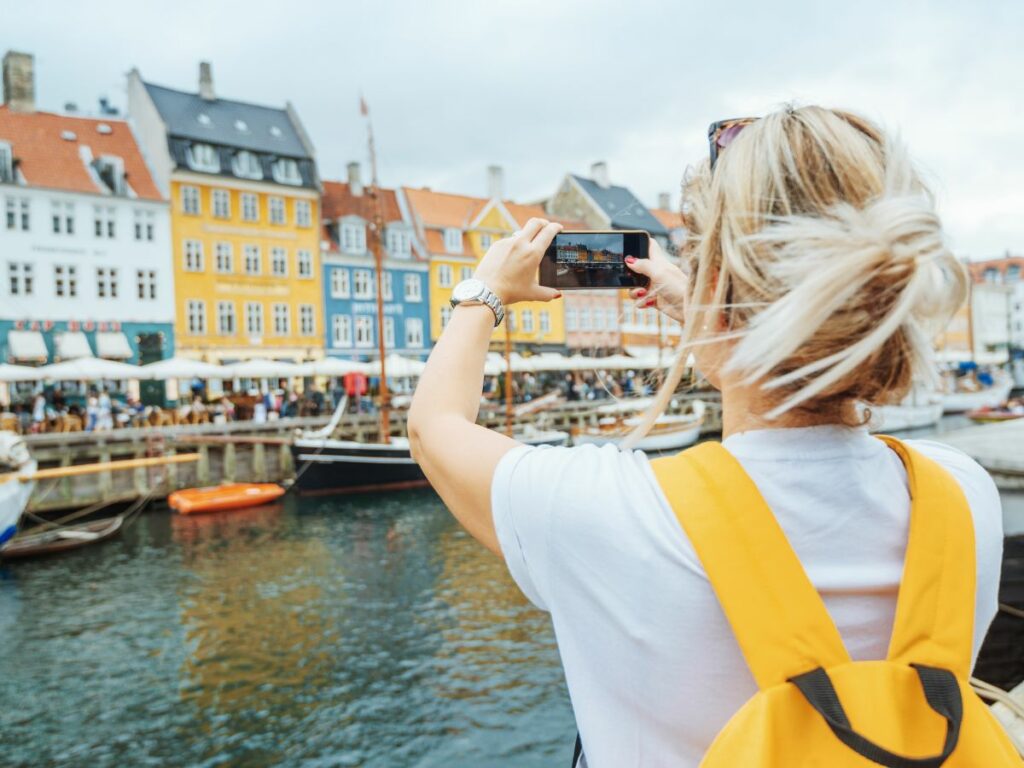 Denmark eSIM woman tourist taking photo copenhagen