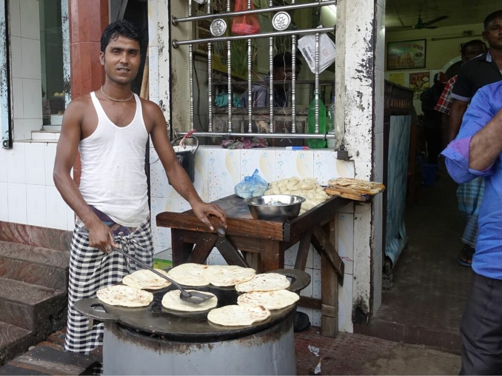 man making roti Bangladesh