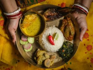 Womans hands holding foods from India